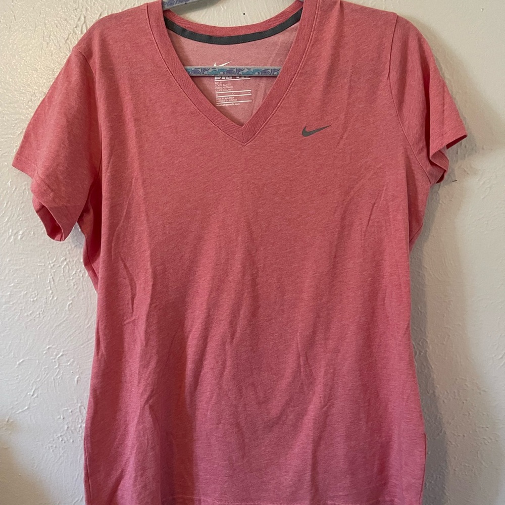 Nike Women's  V-Neck T-Shirt. Color is mixture of pink/peach
